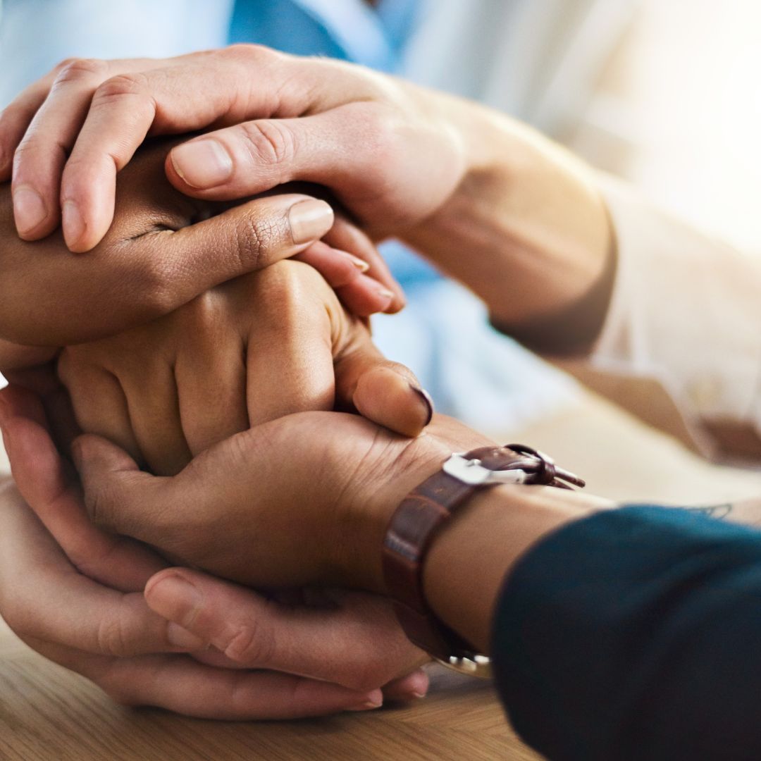 holding hands in support